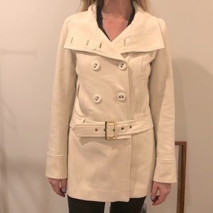 This amazing jacket from Guess is a size extra small.